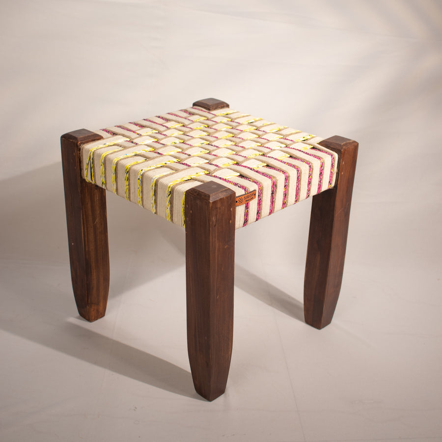 White, yellow and pink wooden stool