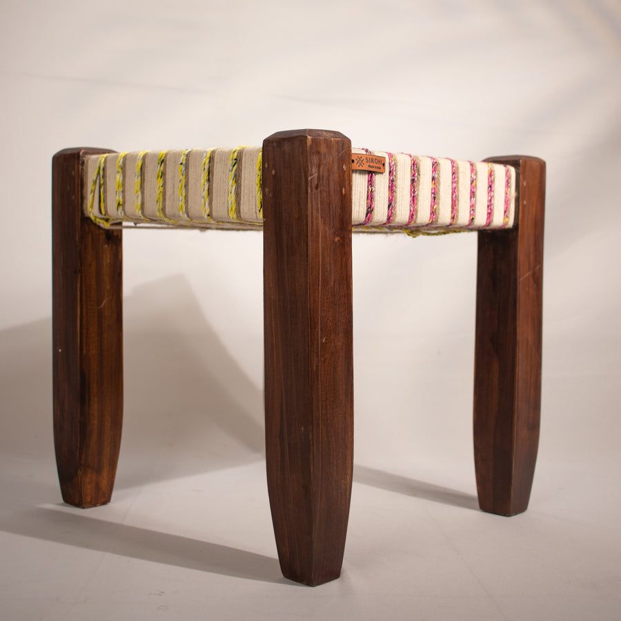 White, yellow and pink wooden stool