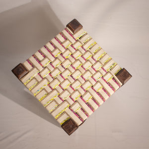 White, yellow and pink wooden stool