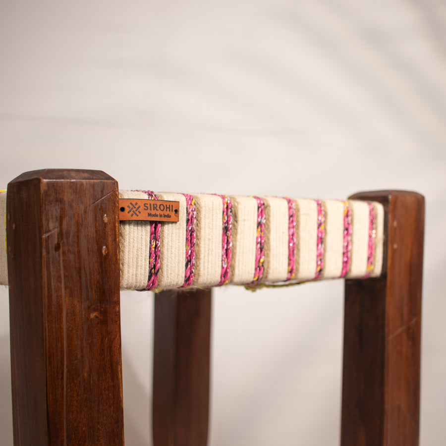White, yellow and pink wooden stool