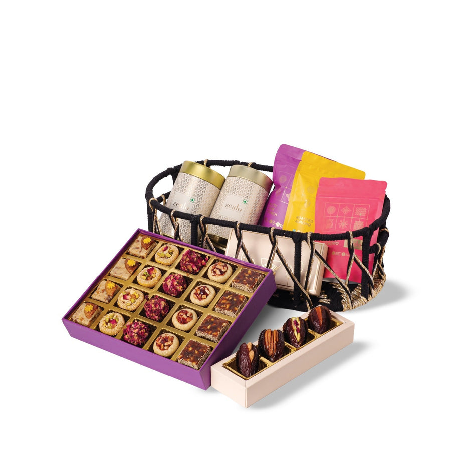 Assorted chocolates in a box and a basket on a white background